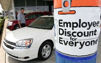 
Keith Neiferd shops at Mike Savoie Chevrolet in Troy, Mich., Wednesday. General Motors Corp. said Wednesday it lost $286 million in the second quarter, dragged down by a $1 billion-plus loss at its North American automotive operations.
 (Associated Press / The Spokesman-Review)