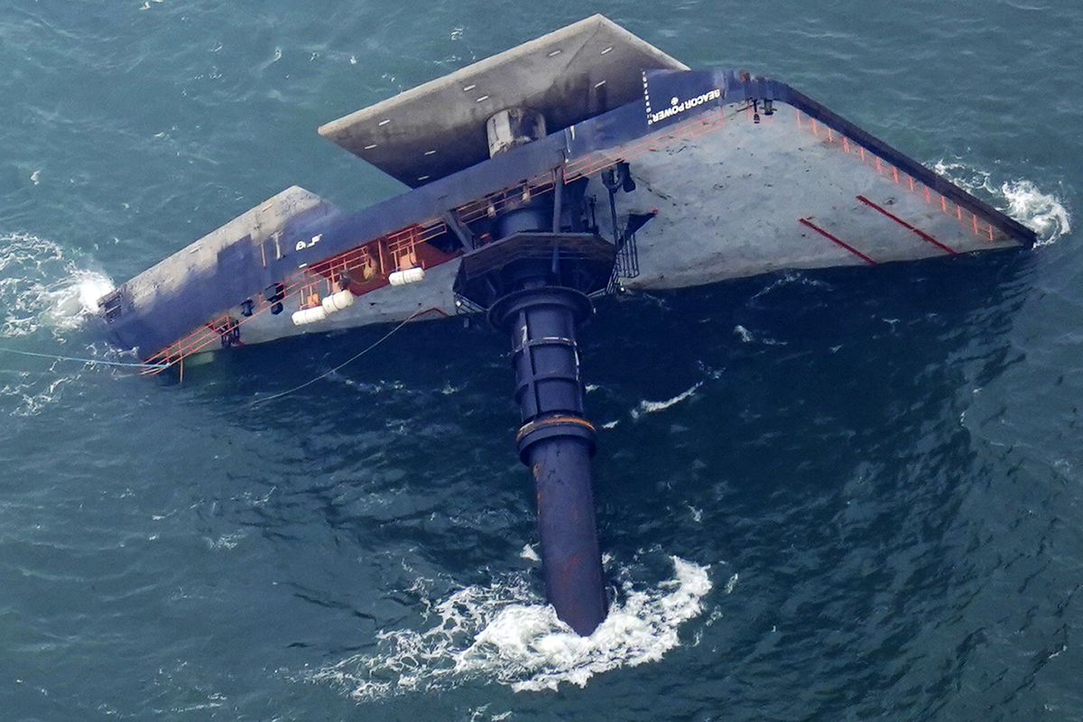 The capsized lift boat Seacor Power is seen seven miles off the coast of Louisiana in the Gulf of Mexico Sunday, April 18, 2021. The vessel capsized during a storm on Tuesday.  (Gerald Herbert)