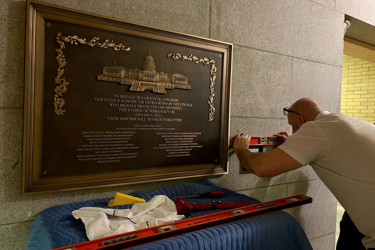 Architect of the Capitol employees installed overnight a plaque honoring law enforcement personnel for their service on Jan. 6, 2021. 