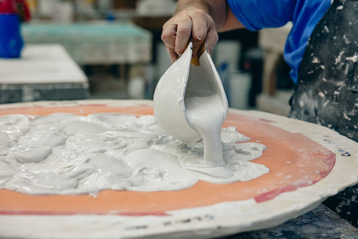 Adam Bergeron pours a mold at Inspired Ornamental, his plaster fabrication company in Salem, N.H., on Aug. 18, 2023. Designers and fabricators are finding new forms for the ornamental material.  (New York Times)