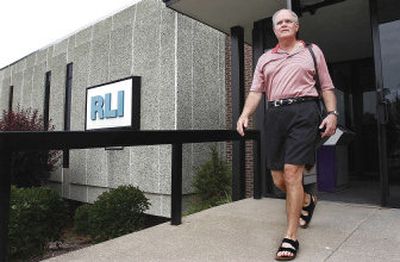 
RLI Corp. Vice President Mike Quine leaves work recently in Peoria, Ill. The insurer took a bold step this summer for a conservative company in a staid industry: It let its employees wear shorts to the office. 
 (Associated Press / The Spokesman-Review)