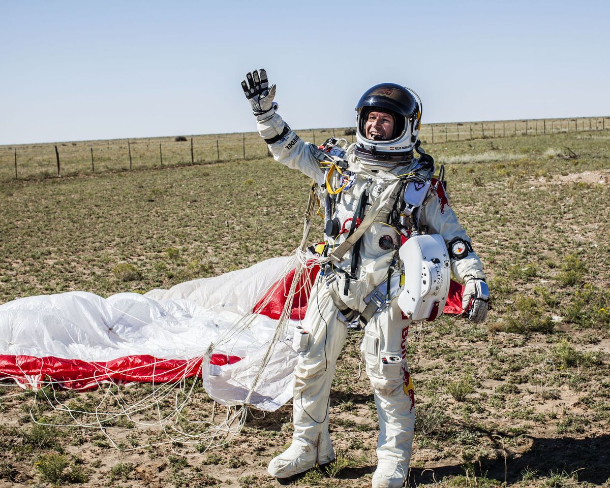 FILE - In this Sunday, Oct. 14, 2012 photo provided by Red Bull Stratos, Pilot Felix Baumgartner of Austria celebrates after successfully completing the final manned flight for Red Bull Stratos in Roswell, N.M.�Baumgartner's death-defying jump from a balloon 24 miles above Earth yielded important information about the punishing effects of extreme speed and altitude on the human body - insights that could inform the development of improved spacesuits, new training procedures and emergency medical treatment. (Balazs Gardi / Red Bull Stratos)