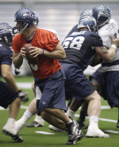 Seattle QB Matt Hasselbeck may not get back on field until season opener. (Associated Press / The Spokesman-Review)