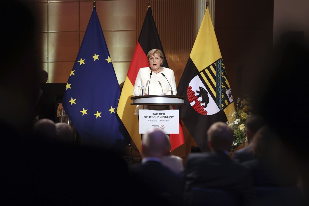 Federal Chancellor Angela Merkel (CDU) speaks at the ceremony marking German Unity Day in the Handel Hall in Halle/Saale, Sunday, Oct. 3, 2021.  (Jan Woitas)