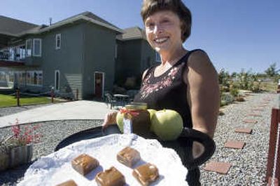 
Ellie Grubich shows off some of her creations from Ellie's Edibles, which she makes at her Green Bluff home. 
 (Christopher Anderson / The Spokesman-Review)