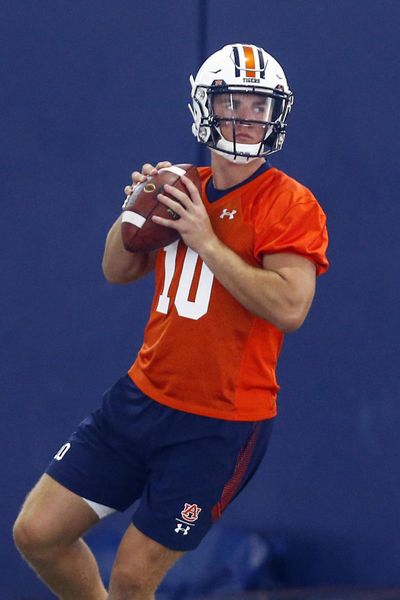 In this Friday, Aug. 2, 2019 photo, Auburn quarterback Bo Nix throws a pass during Auburn’s first practice in Auburn, Ala. Freshman Bo Nix will be Auburn’s starting quarterback in the season opener against Oregon. (Butch Dill / Associated Press)