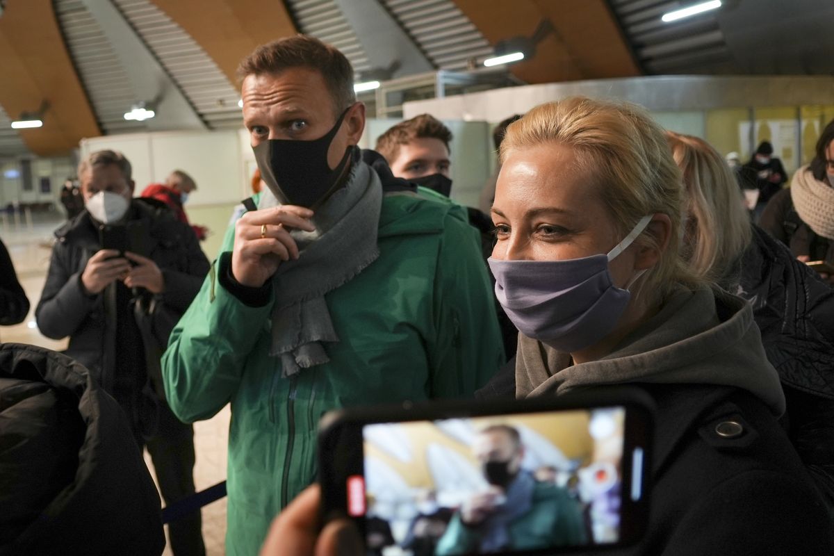 Alexei Navalny and his wife Yuliastand in line at the passport control after arriving at Sheremetyevo airport, outside Moscow, Russia, Sunday, Jan. 17, 2021. Russia