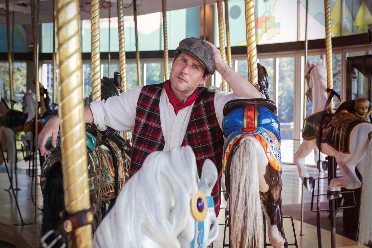 Robby French poses at the Looff Carrousel in downtown Spokane. French plays Billy Bigelow in the Spokane Civic Theatre production of “Carousel” running through Oct. 13.  (Courtesy of Marlee Melinda Andrews)