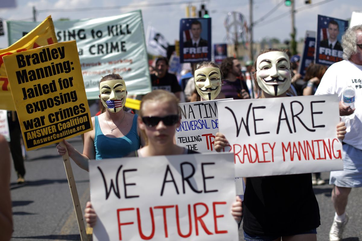 Protesters march during a rally in support of Army Pfc. Bradley Manning outside of Fort Meade, Md., on Saturday. (Associated Press)