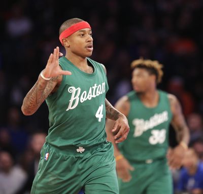 Boston’s Isaiah Thomas reacts after sinking a 3-point basket. (Seth Wenig / Associated Press)