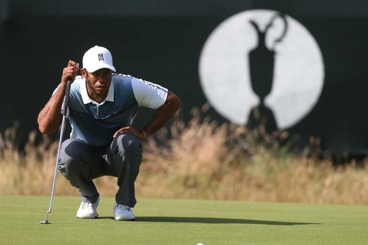 Tiger Woods opened with a 3-under-par 69. (Associated Press)