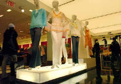 
Mannequins in the Bloomingdale's department store display cotton 1970s'-style tunics in New York. The retail industry this season is hoping to excite customers and ring up sales with styles from years past.
 (Associated Press / The Spokesman-Review)