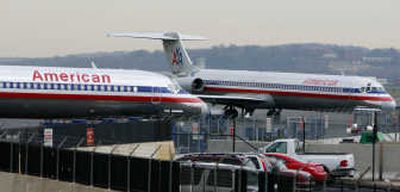 
American Airlines MD-80s park at Washington's Reagan National Airport on Thursday. Hurt by rising fuel prices, more airlines are raising fares.Associated Press
 (Associated Press / The Spokesman-Review)