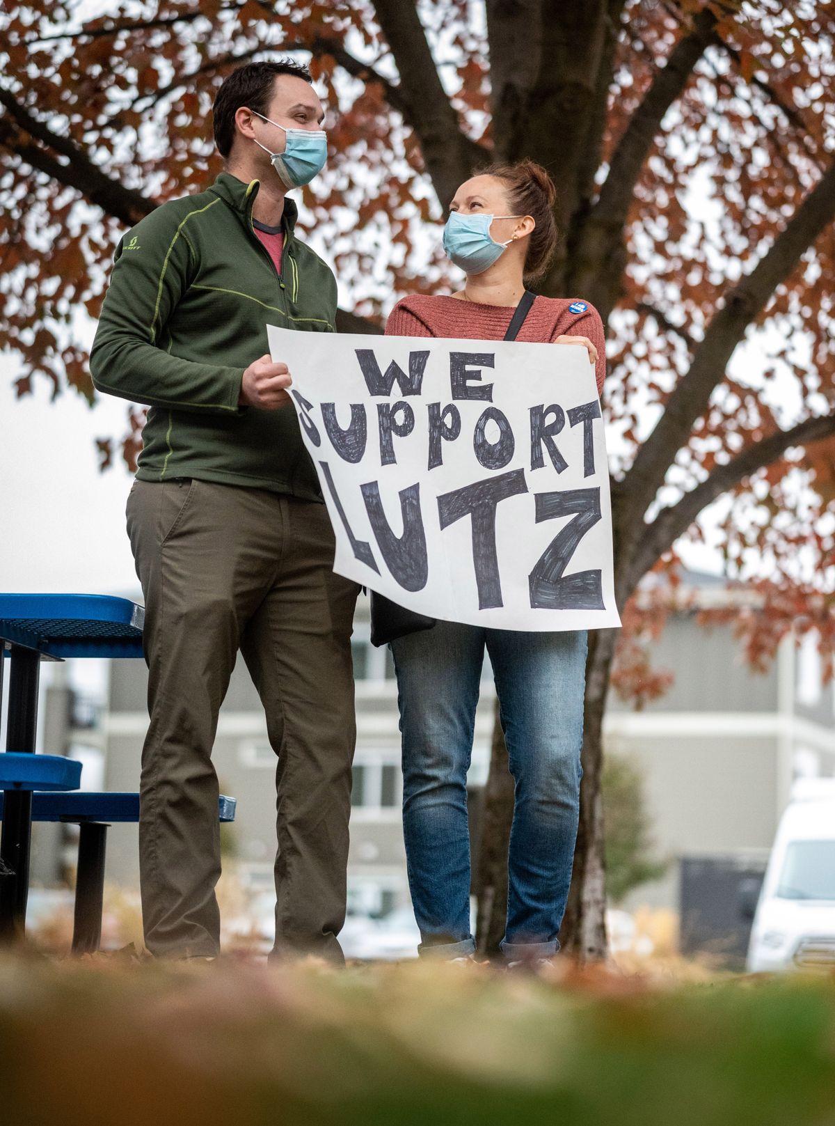 Before the Spokane Regional Health District Board of Health met virtually, Josh Hubbard, a physician and Chelsea Rasmussen a registered nurse attend a small rally Thursday in support of Health Officer Dr. Bob Lutz outside the Public Health Building.  (Colin Mulvany/THE SPOKESMAN-REVIEW)