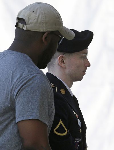 Army Pfc. Bradley Manning is escorted into court at Fort Meade, Md. (Associated Press)