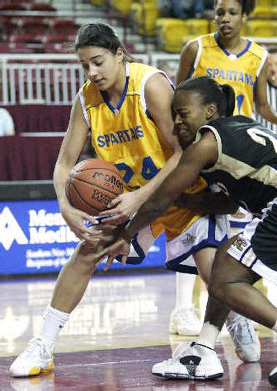 
Idaho's Hannah Wells attempts a steal against Brittany Powell. 
 (Associated Press / The Spokesman-Review)
