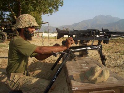A soldier mans a machine gun in the troubled area of Bajur in Pakistan’s tribal region Tuesday.  (Associated Press / The Spokesman-Review)