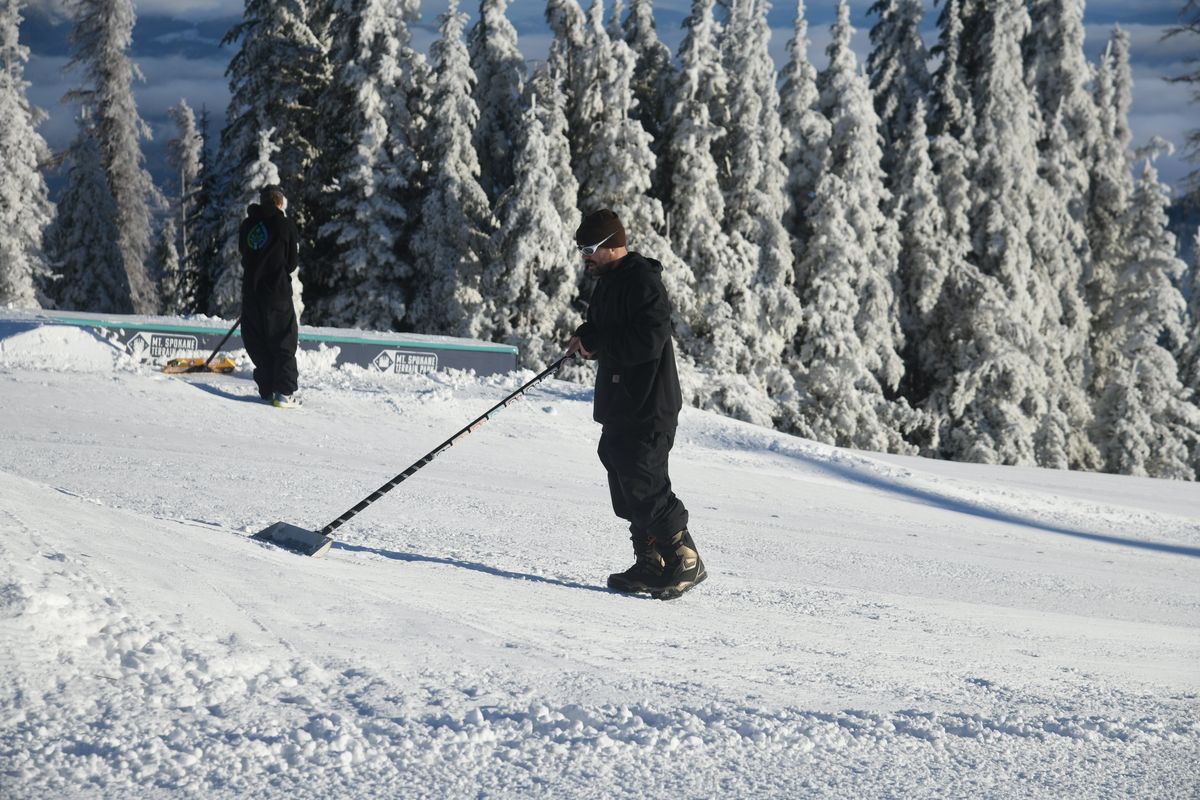 Workers prepare the terrain park at Mt. Spokane Ski and Snowboard Park on Wednesday.  (Michael Wright/The Spokesman-Review)