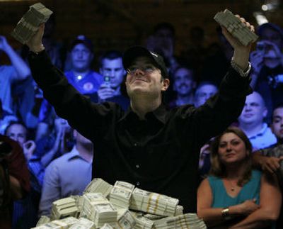 
Jamie Gold, of Malibu, Calif., celebrates after winning $12 million at the World Series of Poker in Las Vegas on Friday. 
 (Associated Press / The Spokesman-Review)