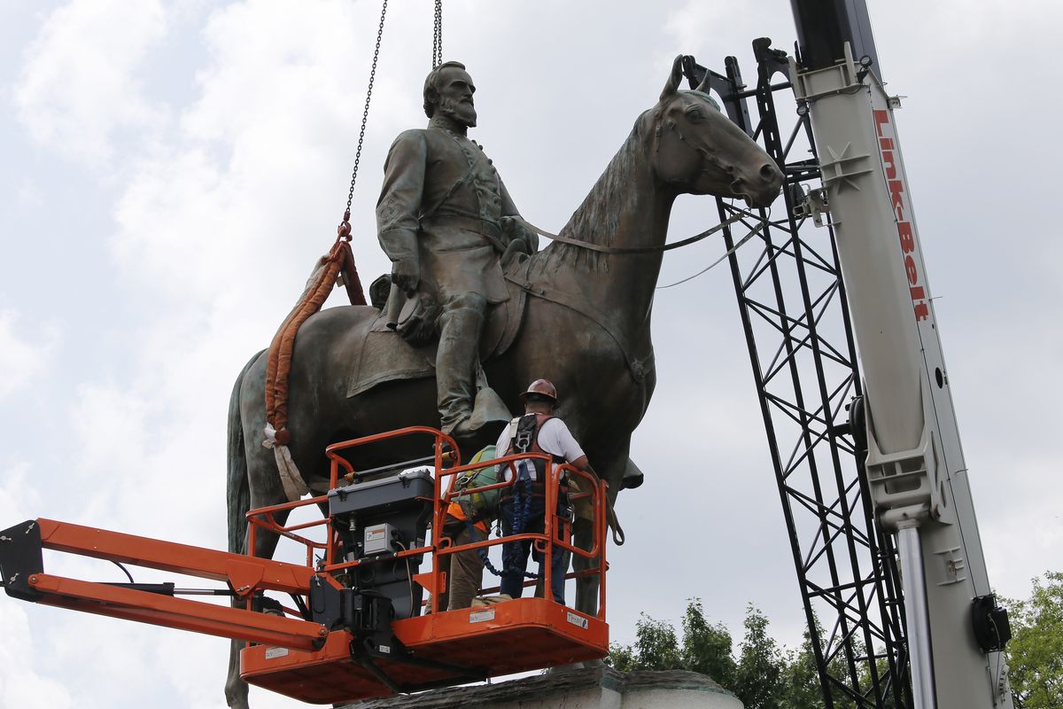 Work crews remove the statue of confederate general Stonewall Jackson, Wednesday, July 1, 2020, in Richmond, Va. Richmond Mayor Levar Stoney has ordered the immediate removal of all Confederate statues in the city, saying he was using his emergency powers to speed up the healing process for the former capital of the Confederacy amid weeks of protests over police brutality and racial injustice.  (Steve Helber)