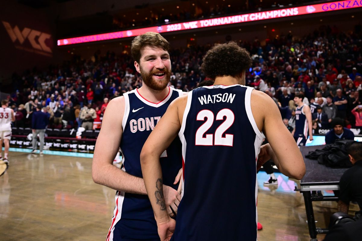 Drew Timme and Anton Watson celebrate after second-seeded Gonzaga’s 77-51 win over No. 1 Saint Mary’s in the 2023 WCC Tournament championship game last March.  (By Tyler Tjomsland/The Spokesman-Review)