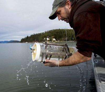 In this Tyler Tjomsland SR photo, Bob Witherow, a technician with the Idaho Department of Environmental Quality, pulls a Kemmerer water sampler from the waters of Lake Coeur d'Alene on Feb. 12. Lake Coeur d'Alene is more polluted than the Animas River, according to a High Country News report. (Tyler Tjomsland / Spokesman-Review)