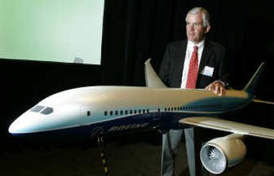 
Mike Bair, Boeing Commercial Airplanes vice president and general manager of the 787 program, poses with a model of the plane on Friday.
 (The Spokesman-Review)