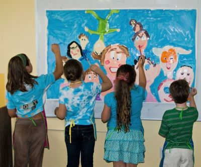 Students work together on a mural at the Dahmen Barn in Uniontown, Wash. The nonprofit center offers weekly “creativity sessions” for children ages 6 to 12.
