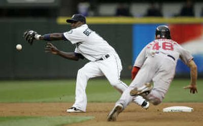 
Boston's Jacoby Ellsbury steals second as the ball bounces off the glove of Seattle shortstop Yuniesky Betancourt.Associated Press
 (Associated Press / The Spokesman-Review)