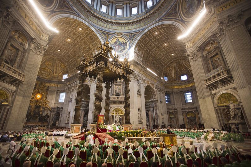 Pope Francis, top center, celebrates a mass in St. Peter's Basilica at the Vatican, Sunday, Oct. 5, 2014 to open the extraordinary Synod on the family. Pope Francis on Sunday opened a two-week meeting of bishops and cardinals from around the world aimed at making the church's teaching on family life � marriage, sex, contraception, divorce and homosexuality � relevant to today's Catholic families. (Alessandra Tarantino / Associated Press)
