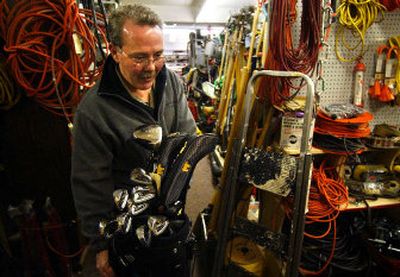 
SCOPE Volunteer John Baldwin enters pawnshop transactions from the previous day into the police database at the Spokane Valley Police Station Tuesday.
 (Liz Kishimoto / The Spokesman-Review)
