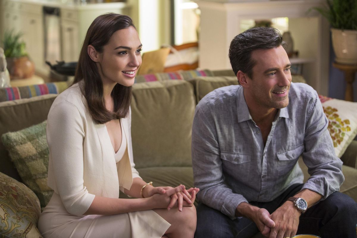 Gal Gadot, left, and Jon Hamm in "Keeping Up With The Joneses." (Frank Masi / AP)