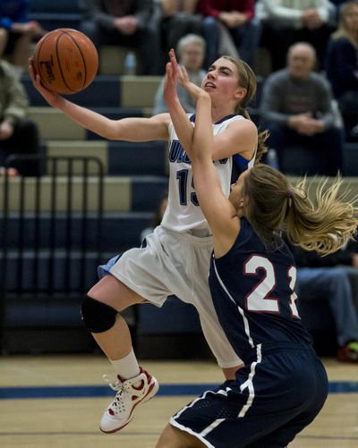 Gonzaga Prep’s Kayla Leland (15) shoots for 2 points over Mt. Spokane’s Lexie Hereford (21) in the first half, Tuesday, Jan. 29, 2013, at Gonzaga Prep High School. (Colin Mulvany / The Spokesman-Review)