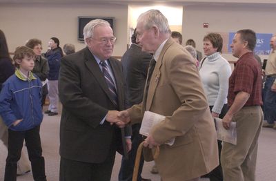 The Spokesman-Review Pastor Ian Robertson, left, greets parishoners at Spokane Valley Church of the Nazarene in April 2007. He was named Citizen of the Year by the Greater Spokane Valley Chamber of Commerce. (File / The Spokesman-Review)