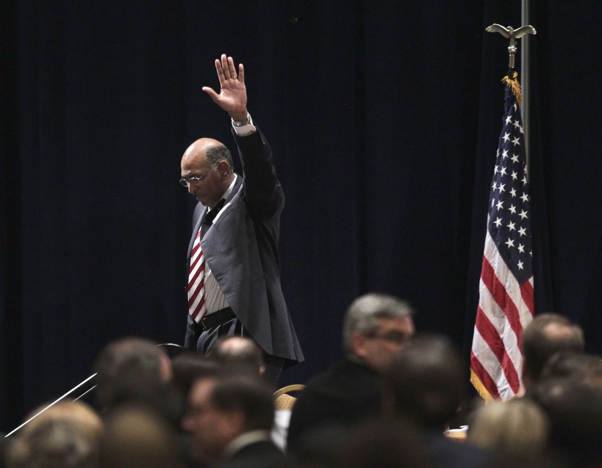 Republican National Committee Chairman Michael Steele walks off stage after announcing that he would drop his re-election bid Friday.  (Associated Press)