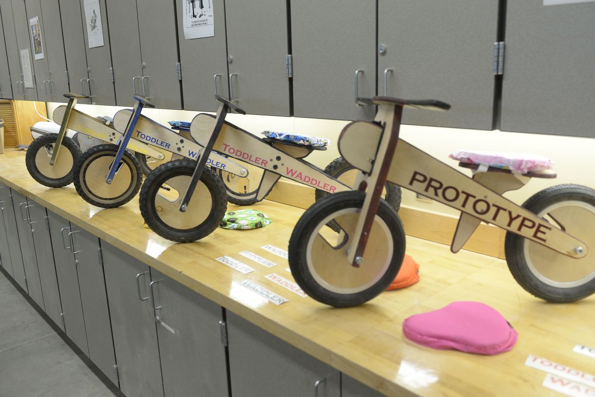 Models of a simple toddler bike designed by Austin Schatz is on a side bench Monday.