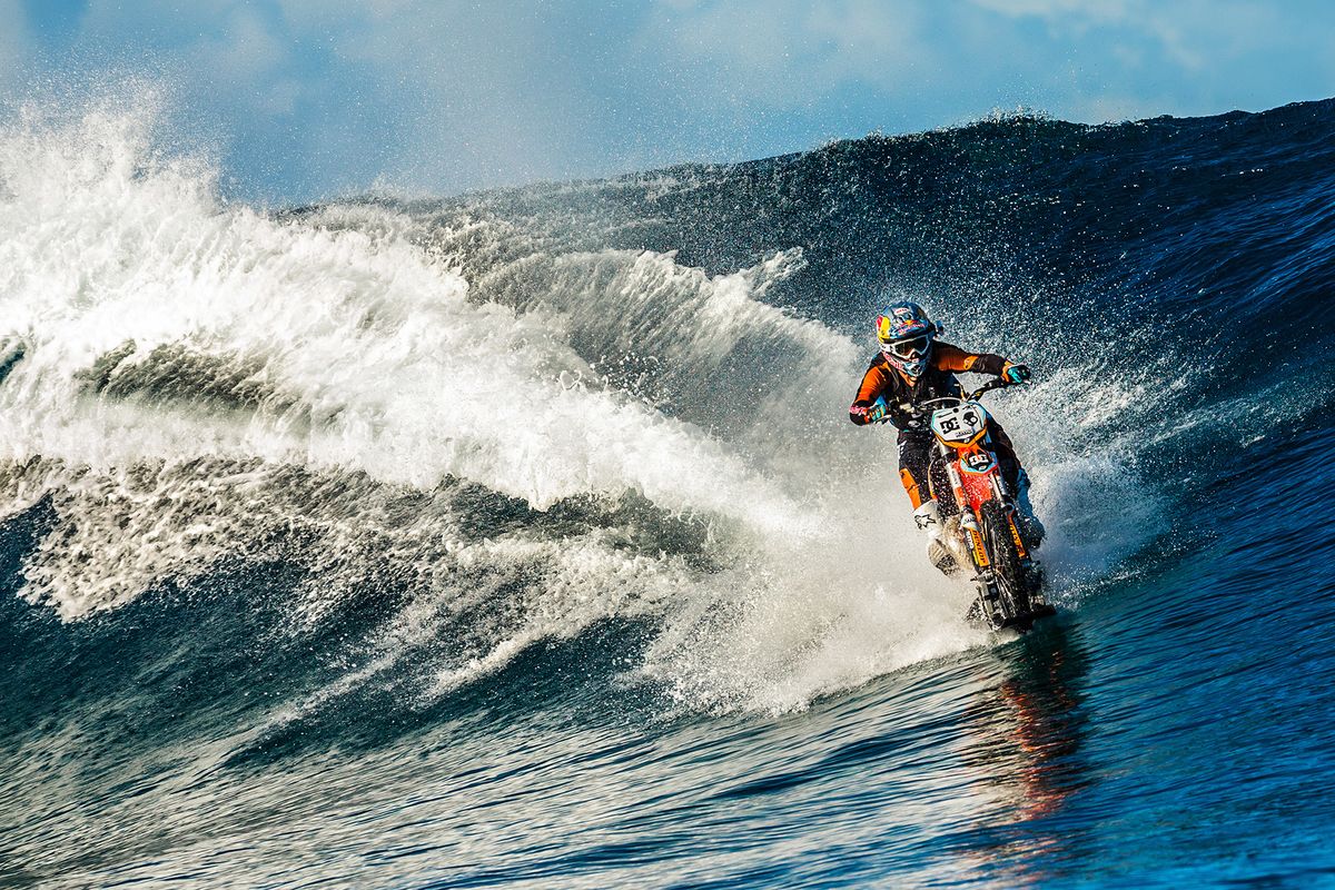 Daredevil Robbie Maddison takes his specially-modified motorcyle across the waves in Tahiti, French Polynesia. (Associated Press)