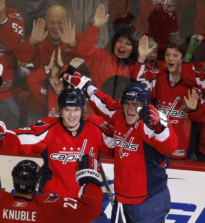 Washington Capitals’ Alex Ovechkin, right, celebrates with teammates after scoring the go-ahead goal against Tampa Bay.  (Associated Press)