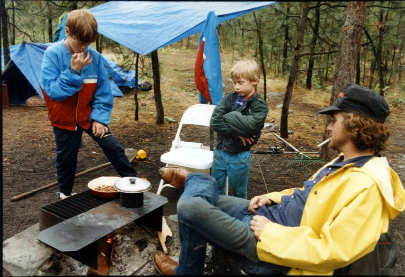 A family coops over a campfire at a campground in Riverside State Park. (File)