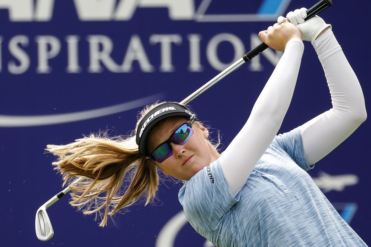 Brooke M. Henderson watches her tee shot on the 17th hole during the third round of the LPGA