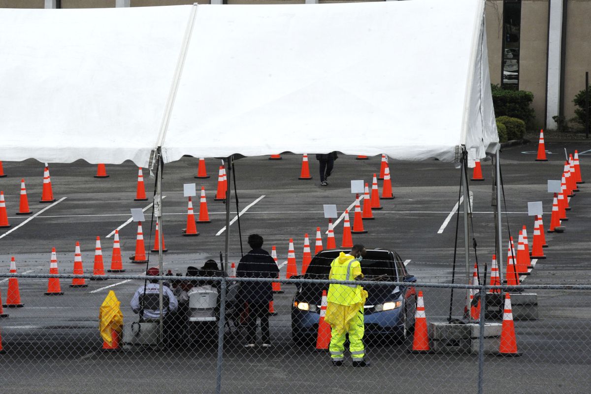 Workers at a mostly empty COVID-19 vaccination clinic located at Cathedral of the Cross A.O.H. Church of God in Birmingham, Ala., are shown Monday, May 3, 2021. New COVID-19 cases are declining across the most of the country, even in some states with vaccine-hesitant populations. But almost all states bucking that trend have lower-than-average vaccination rates, and experts warn that relief from the pandemic could be fleeting in regions where few people get inoculated.  (Jay Reeves)