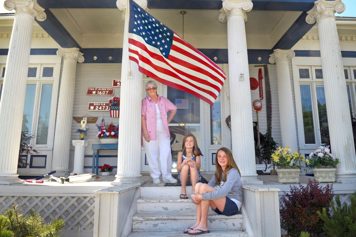 Bernice Leavitt Jackson relaxes on the front porch of her Davenport home while visiting with her granddaughters Kyra Arland, front, and Hailey Arland, in 2011. (File)