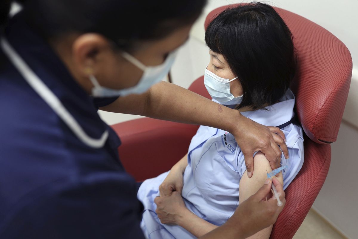 Nurses at the Royal Free Hospital, London, simulate the administration of the Pfizer vaccine to support staff training ahead of the rollout, in London, Friday Dec. 4, 2020. (Yui Mok)