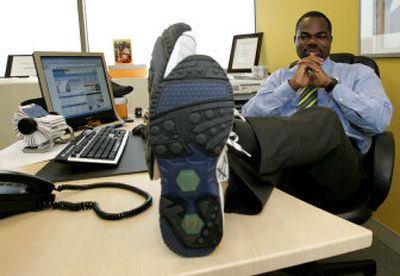 
Issac Daniel wears the sneakers he designed, which include a tiny Global Positioning System chip embedded inside the shoe, on Wednesday in Miami. 
 (Associated Press / The Spokesman-Review)