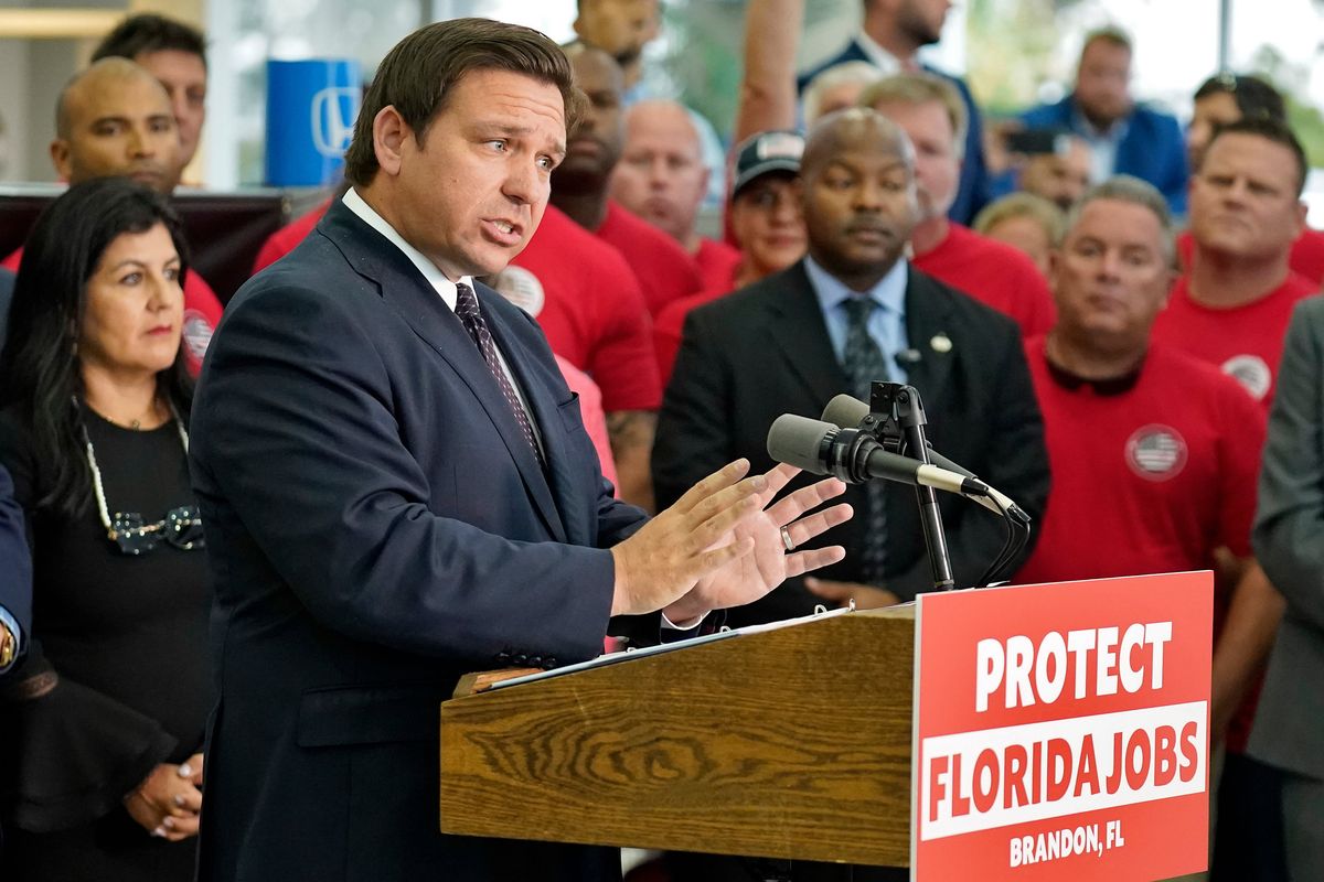 Florida Gov. Ron DeSantis speaks to supporters and members of the media before a bill signing Thursday in Brandon, Fla. DeSantis signed a bill that protects employees and their families from coronavirus vaccine and mask mandates.  (Chris O