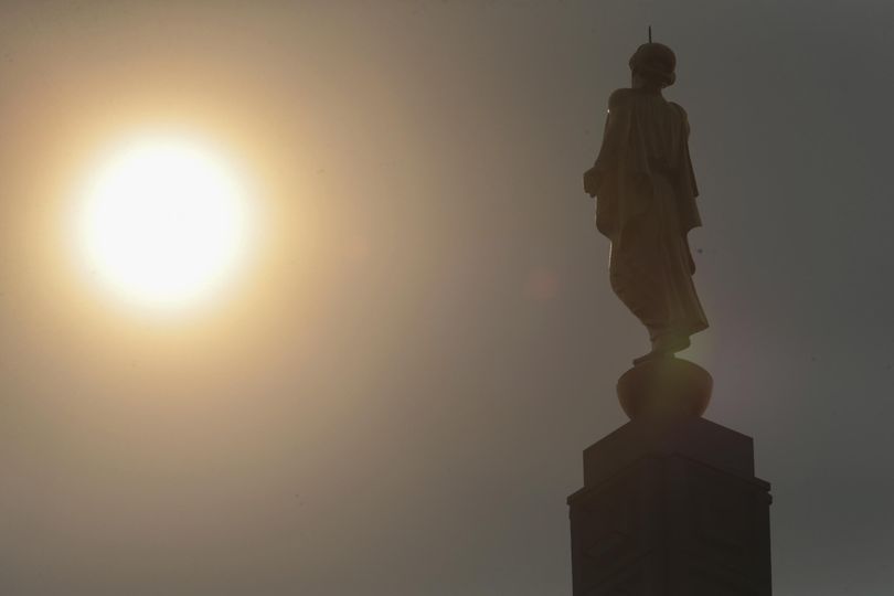 The statue of the Angel Moroni is seen under smoky skies in Idaho Falls, Idaho, Tuesday, Sept. 5, 2017. The heavy smoke that had set in over Idaho Falls from fires across the state has somewhat abated, thanks to the past week’s rainfall and cooler temperatures. (John Roark / AP)