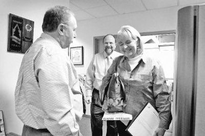 
Bev Twillmann, right, laughs with Kootenai County Commissioners Rich Piazza, left, and Rick Currie after a commission meeting Tuesday. She represents Neighbors for Responsible Growth, a group that wants to preserve Kootenai County's rural areas. 
 (Jesse Tinsley / The Spokesman-Review)
