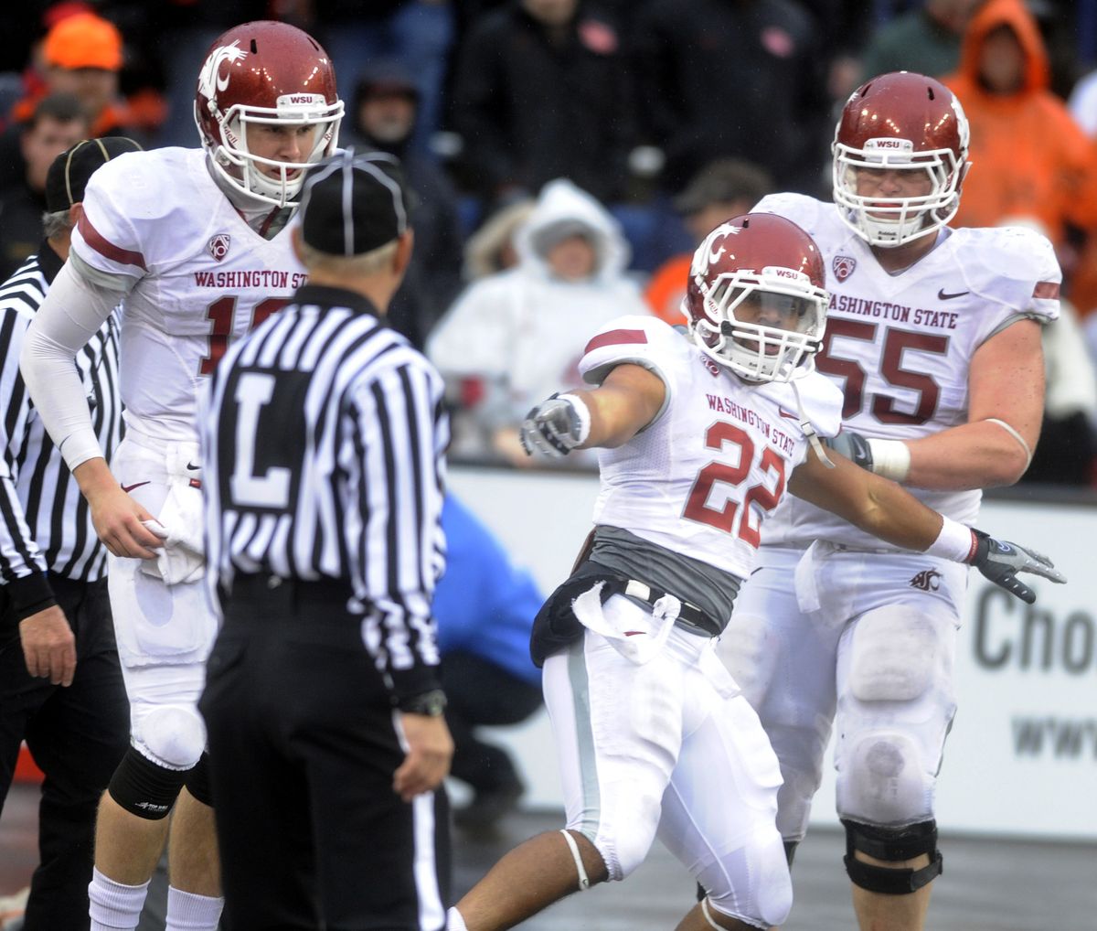 His 5-yard touchdown run in the fourth quarter Saturday gave Chantz Staden reason to fly and put a stamp on Washington State’s win.  (Associated Press)