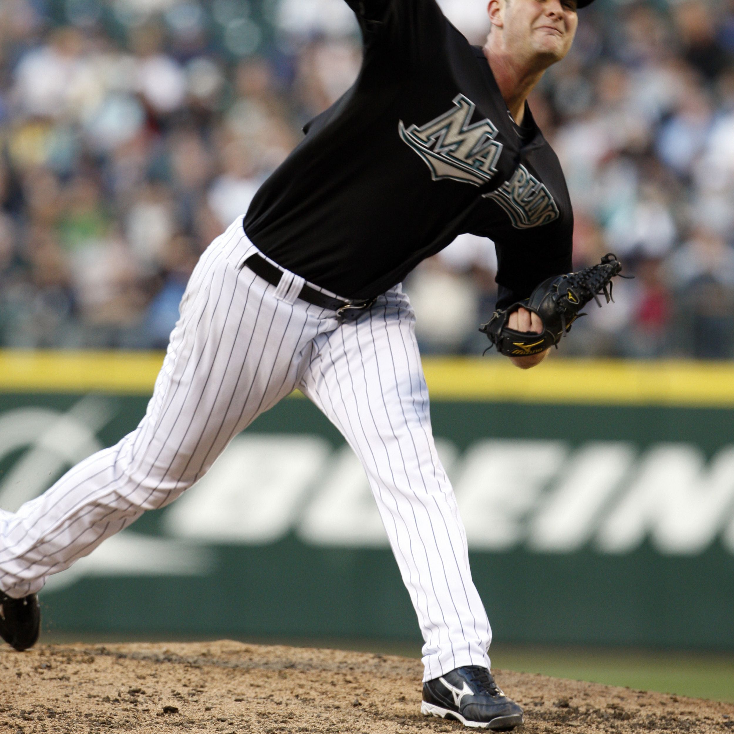 Volstad pitches, hits Marlins past M's