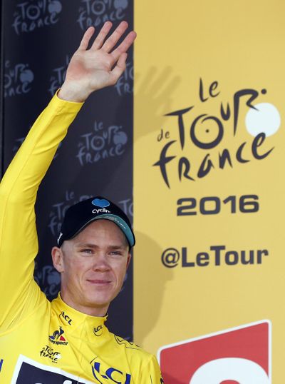 Britain’s Chris Froome, shown celebrating on Wednesday, extended his overall lead Friday during a somber 13th stage of the Tour de France. (Christophe Ena / Associated Press)
